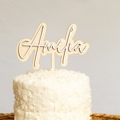 custom name cake topper on white cake